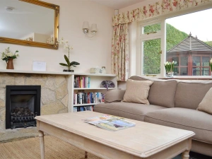 Living area with windows overlooking the garden