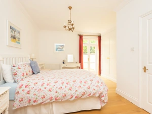 Bedroom 1 with door to the rear courtyard