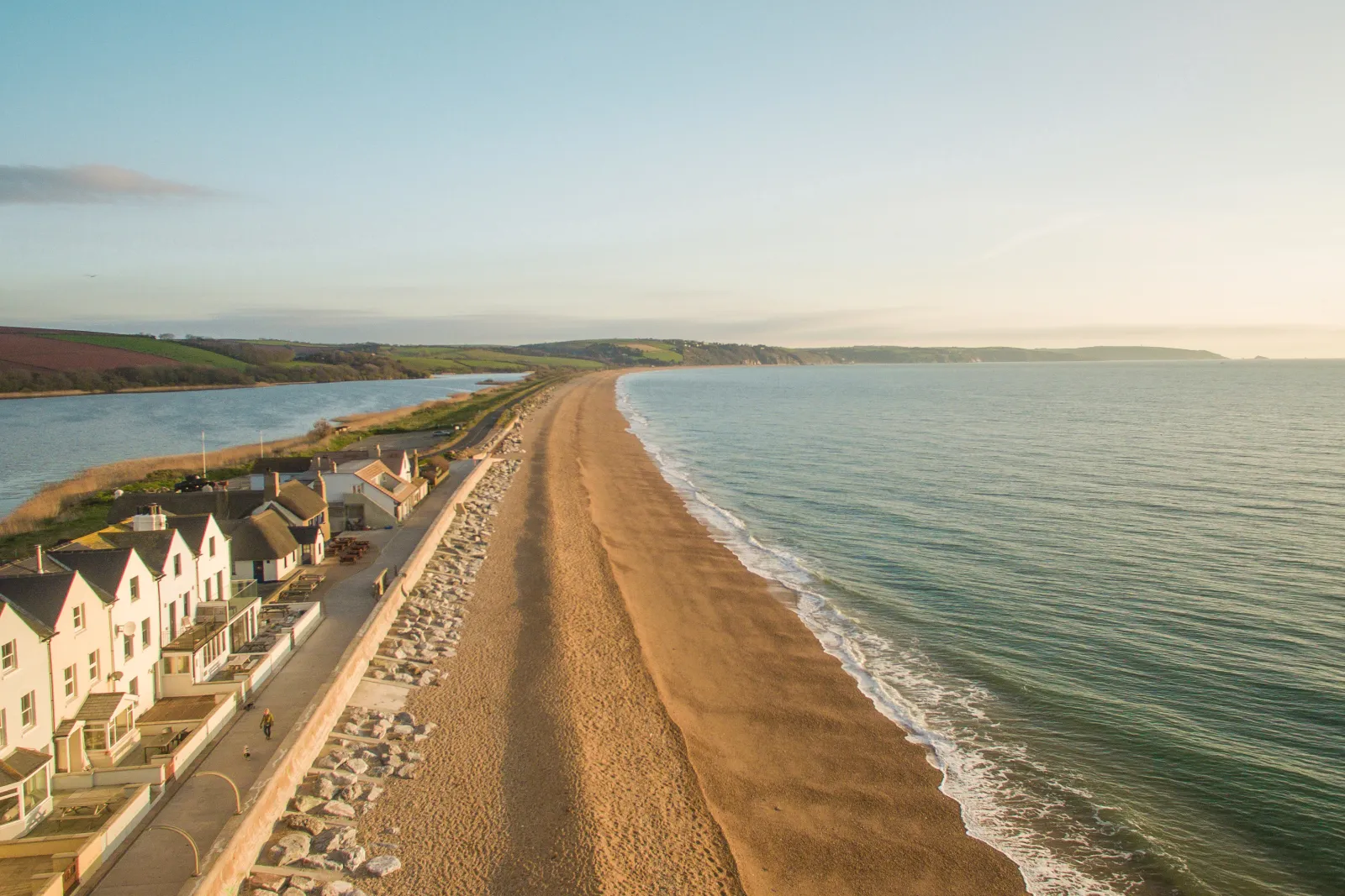The stunning stretch of beach along Slapton Line, with Slapton Ley Nature Reserve on the other side of the scenic coastal road.