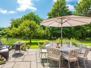 Relax on the large terrace amidst lovely private grounds