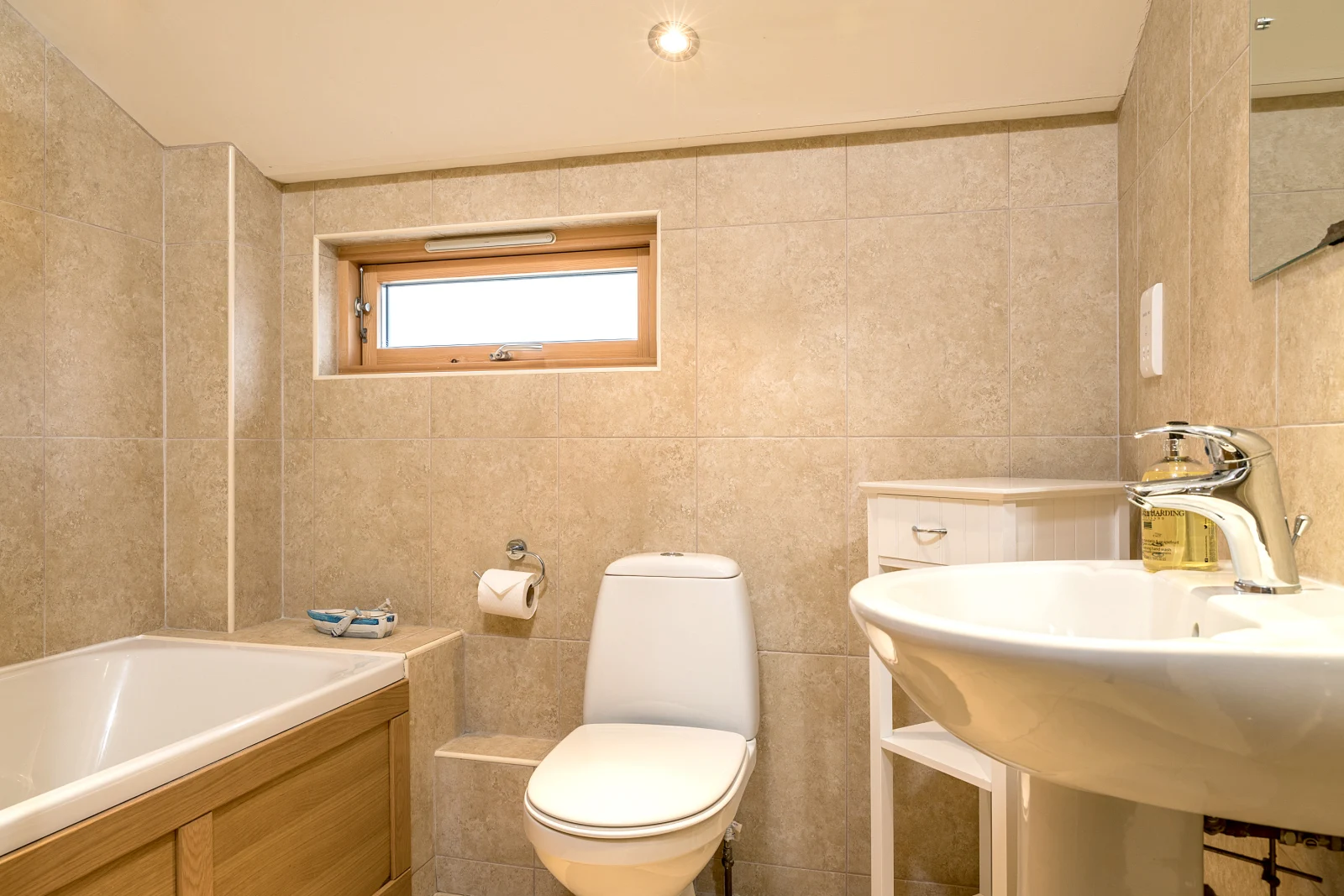 The spacious family bathroom at the front of the house has a bath, wc and hand basin.