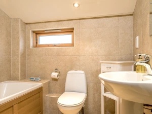 The spacious family bathroom at the front of the house has a bath, wc and hand basin.
