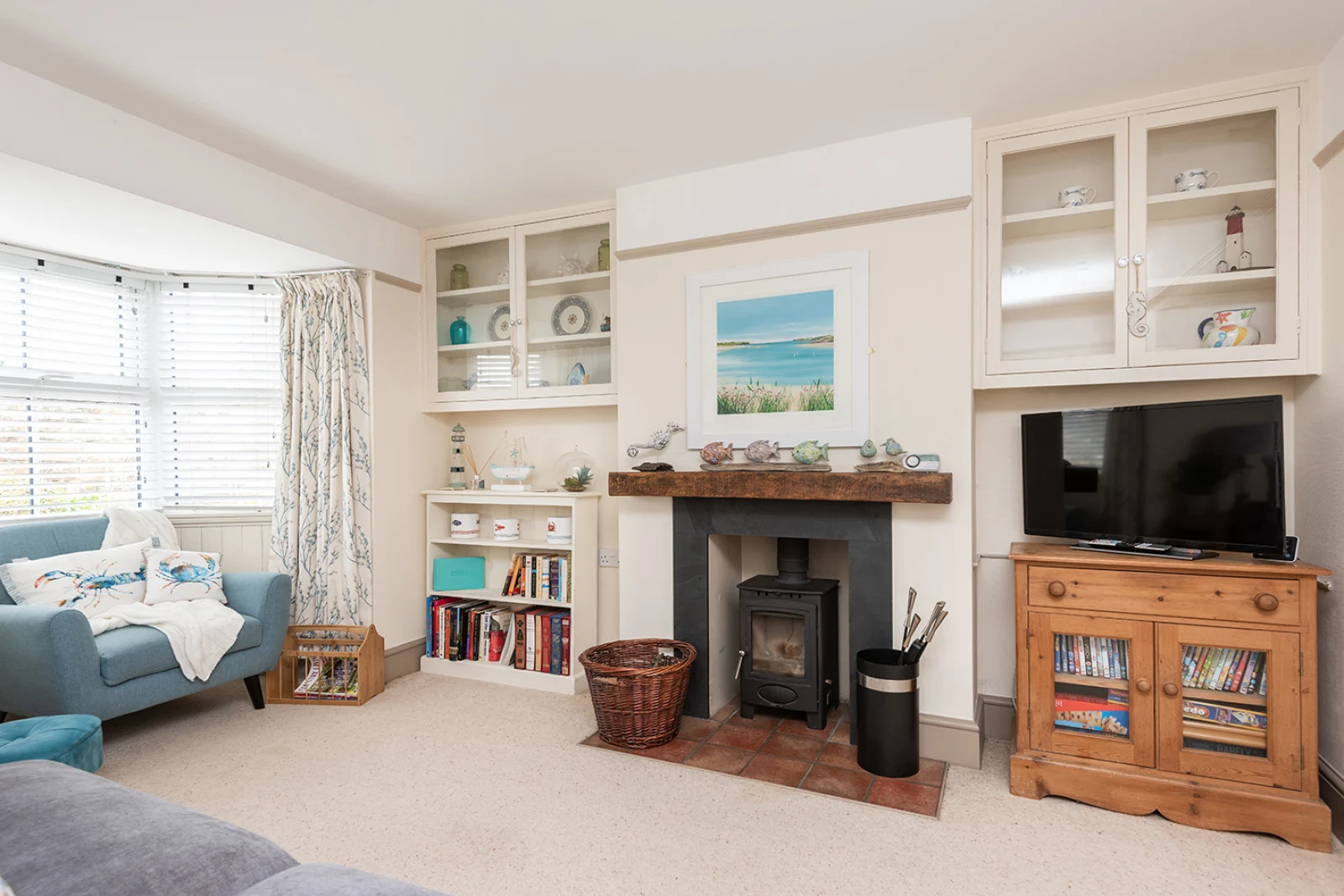 The living room is cosy and tasteful with a log burner for cooler evenings
