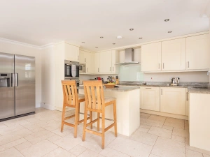 The kitchen with breakfast bar