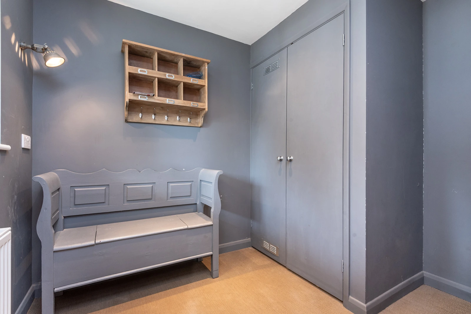 The very useful and still tastefully decorated boot room.