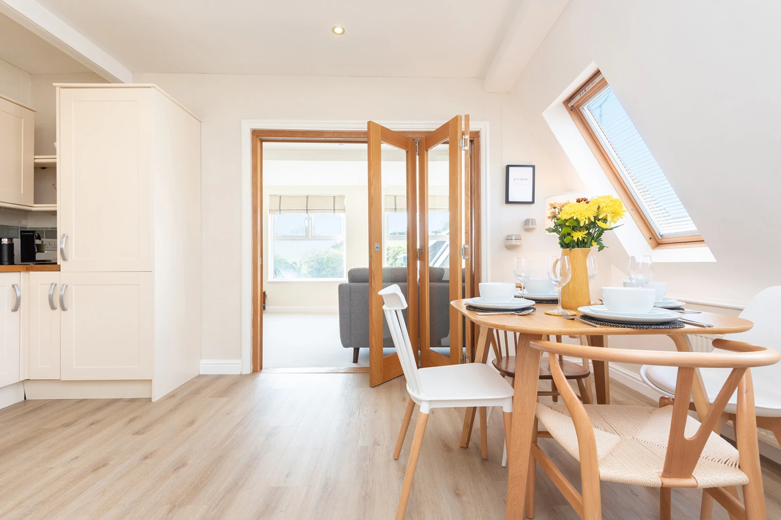 The open plan kitchen dining room, complete with bi-folds leading to the lounge.