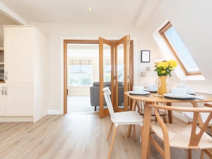 The open plan kitchen dining room, complete with bi-folds leading to the lounge.