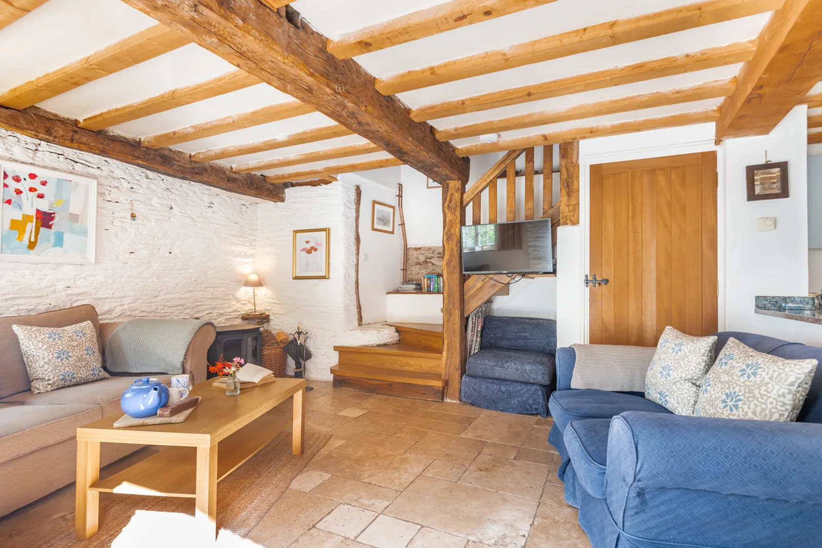 The sitting room with woodburner stove.