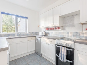The kitchen is fully equipped with full size appliances