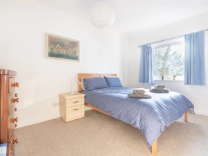 A king-size bed in the master bedroom with room for a cot, if needed.