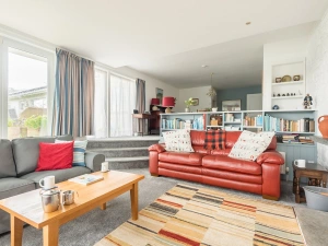 The layout of the living room with three steps up to the dining area.