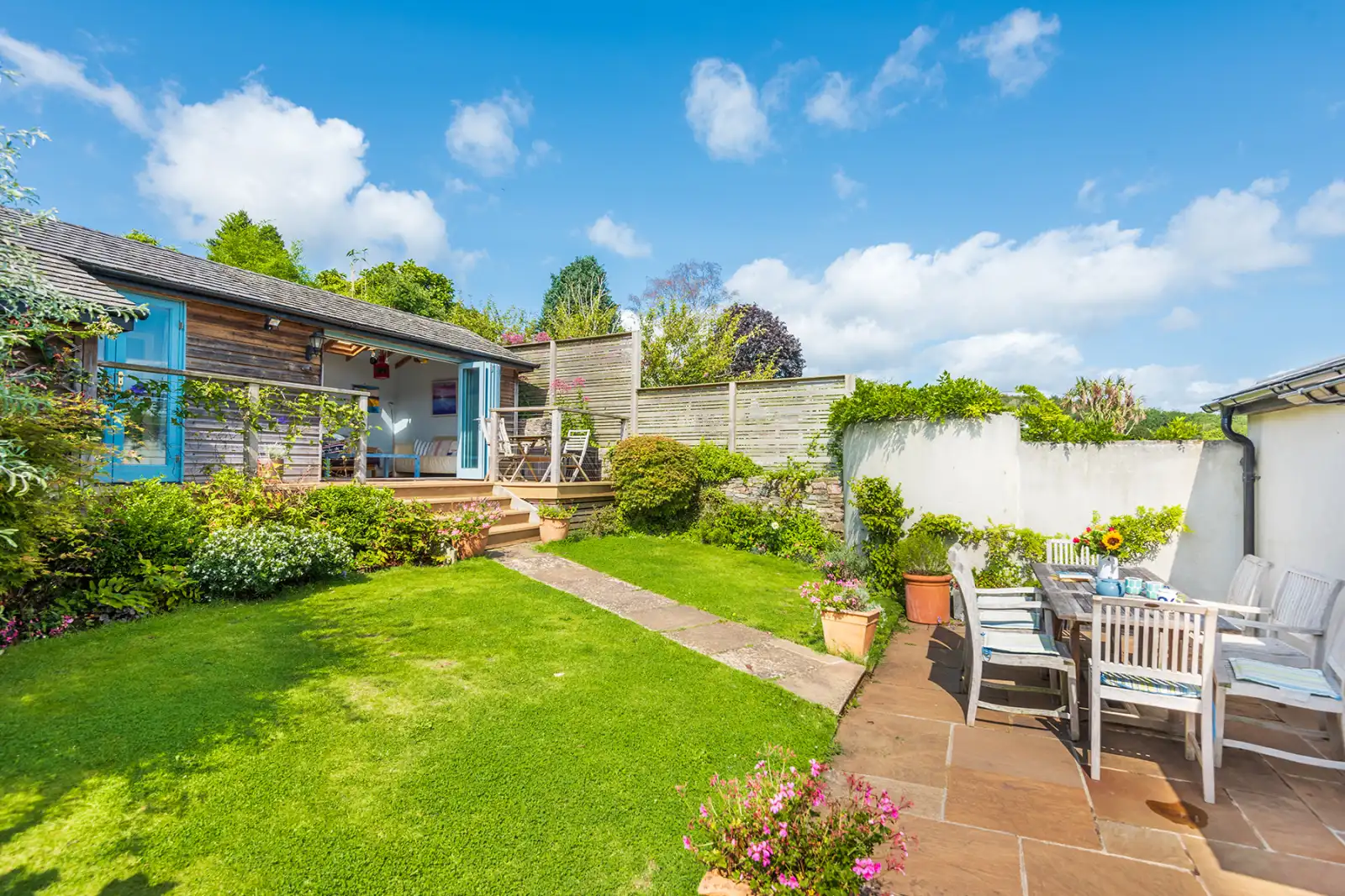 Back garden with studio at the rear, perfect for those looking to escape for a short while.