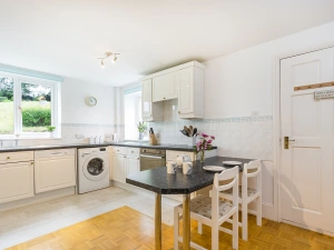 The large kitchen with plenty of work surface space.