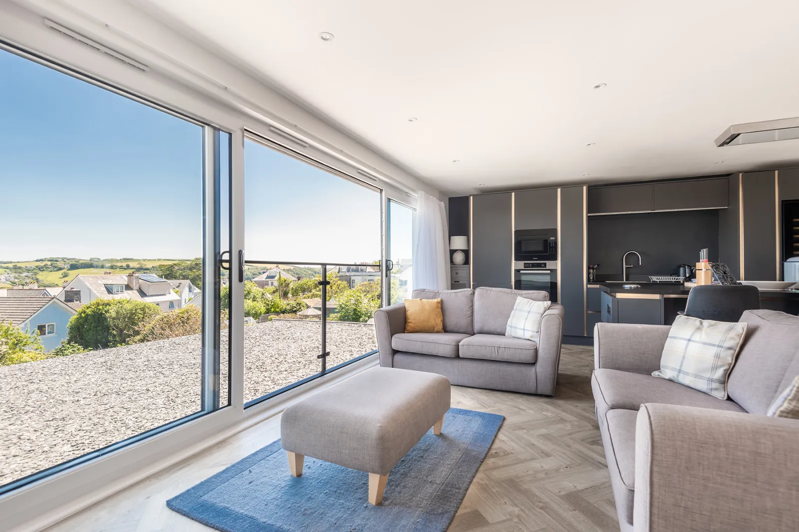 Open plan sitting room with estuary views