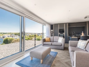 Open plan sitting room with estuary views