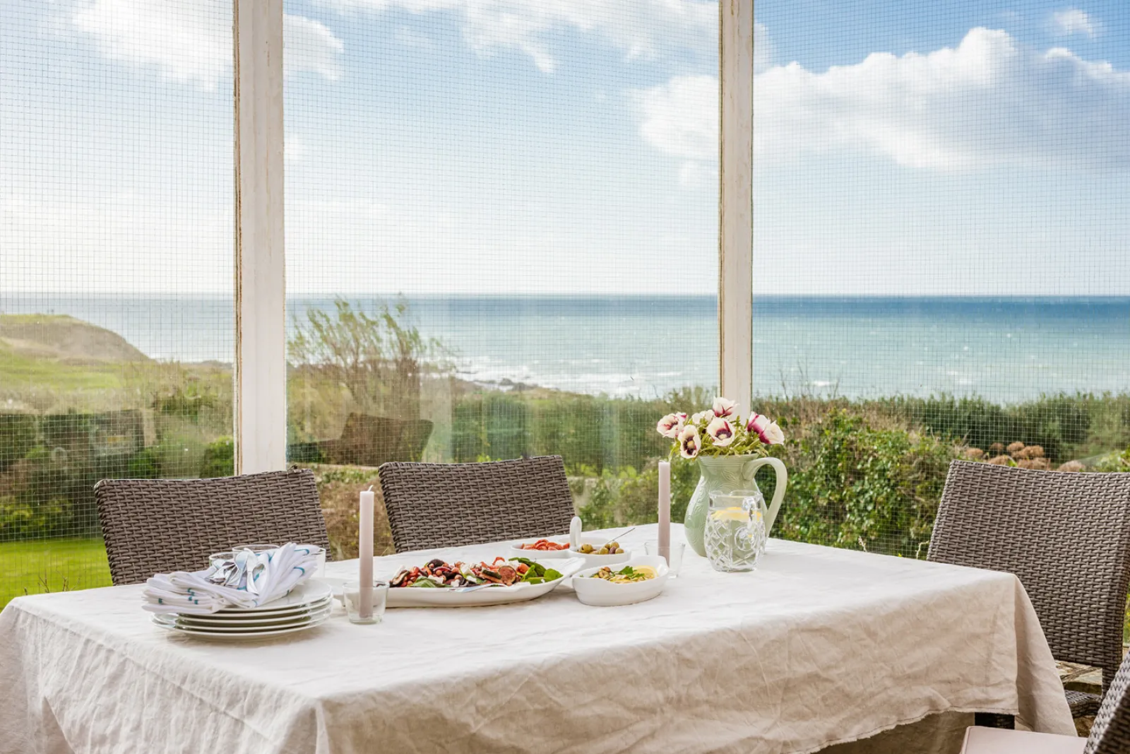 Patio dining area with stunning sea views.