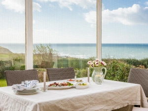 Patio dining area with stunning sea views.