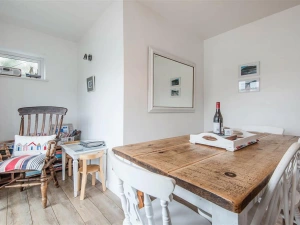 The dining area, with doors to the balcony