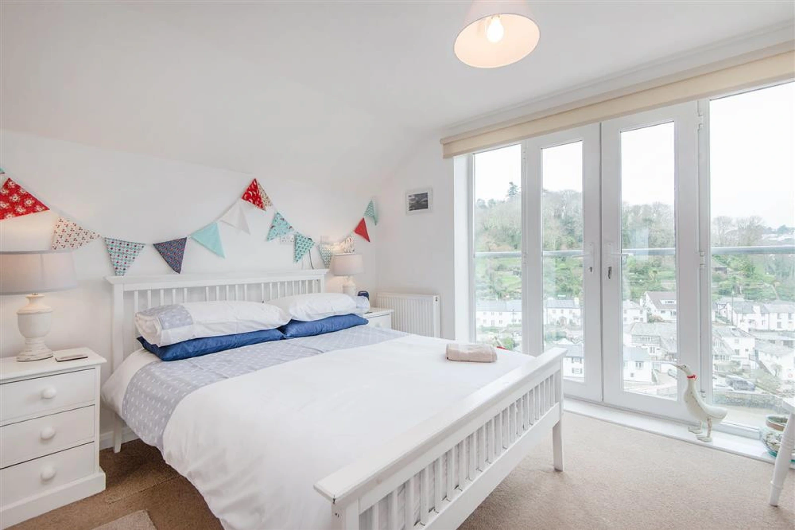 Beautiful master bedroom with waterside view