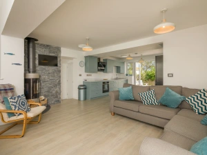 The very attractive lounge with log burner