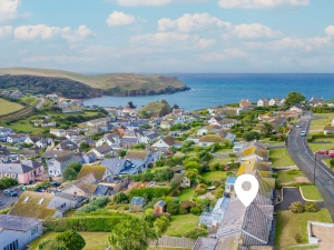 An aerial view of Spindrift and its location - in the village of Hope Cove, just a short walk to the beaches and restaurants.