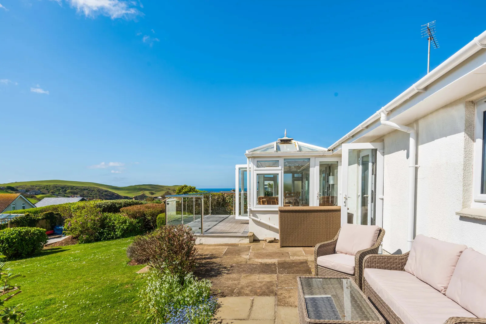 The lovely rear patio area, furnished to enjoy the views and sunshine! 