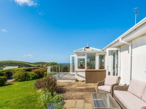 The lovely rear patio area, furnished to enjoy the views and sunshine! 
