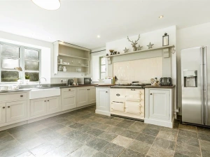 The huge farmhouse kitchen with AGA.