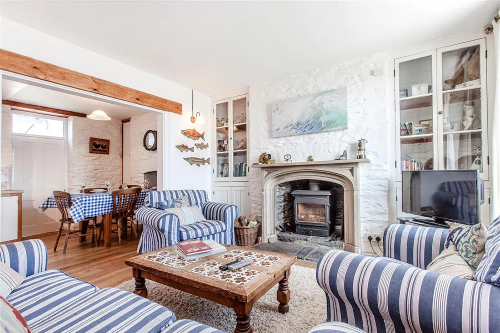 The delightful sitting room with woodburner stove.