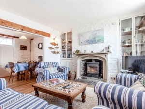 The delightful sitting room with woodburner stove.