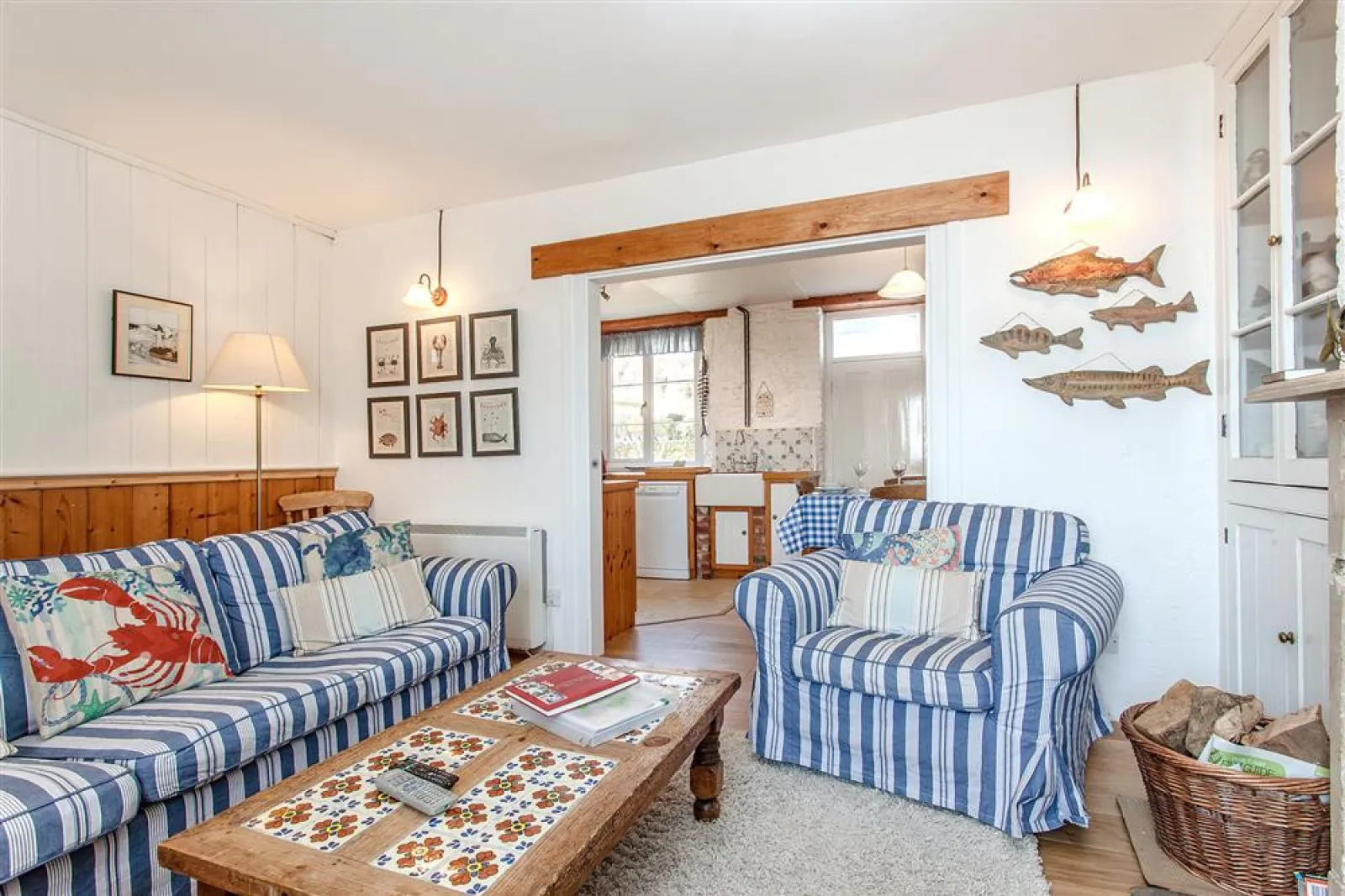 Another view of the sitting room with wood burner stove.