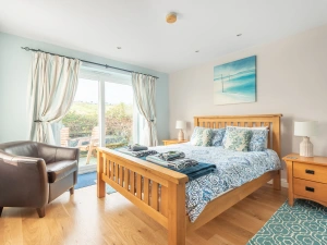 The bedroom with access to decking