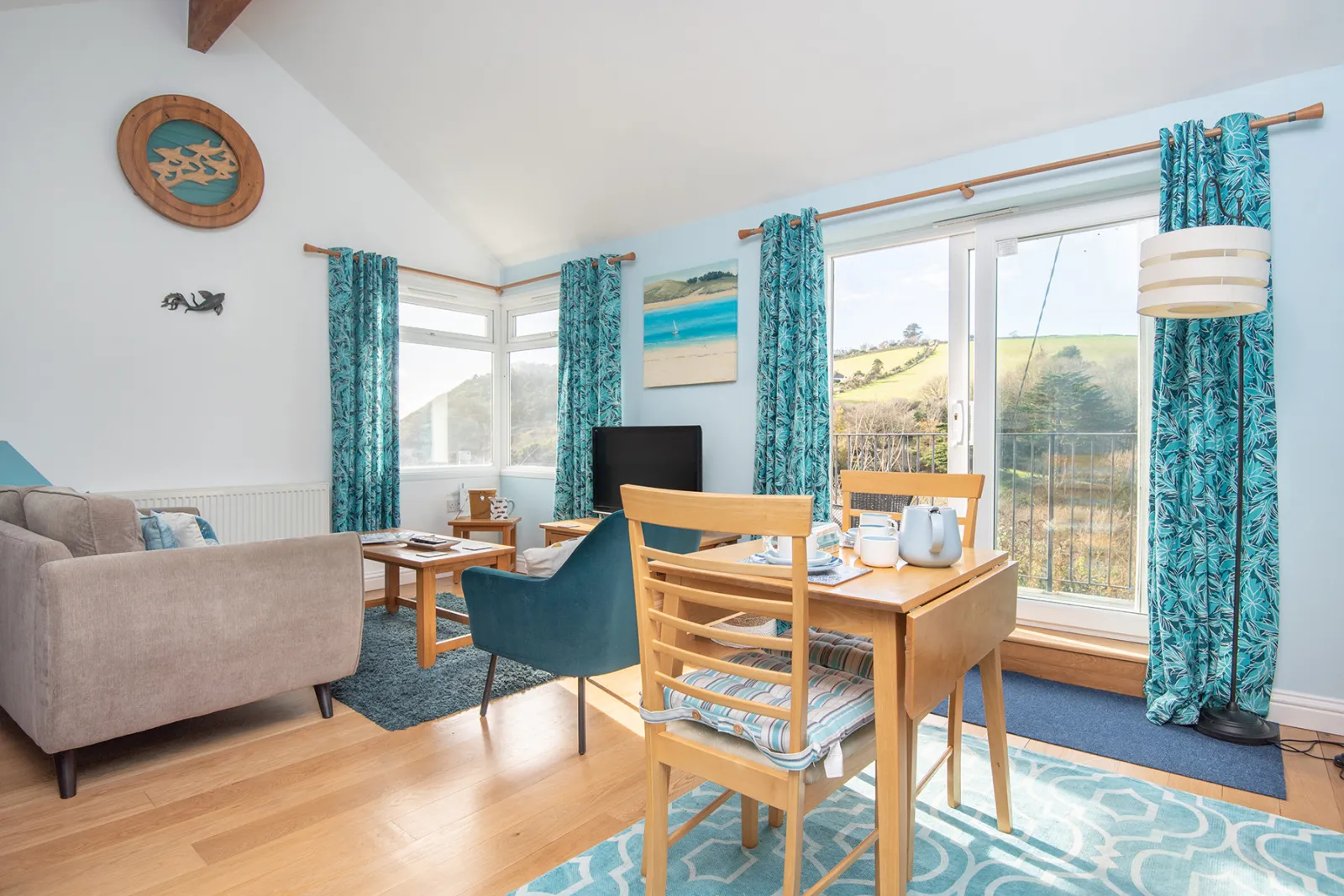 The dual aspect living space with sea and countryside views