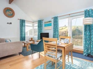 The dual aspect living space with sea and countryside views