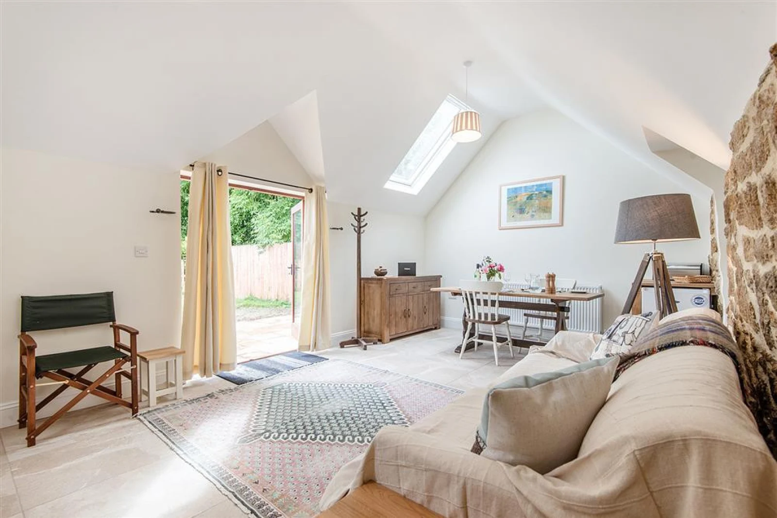 The open plan living area with french doors to the outside space