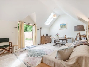 The open plan living area with french doors to the outside space