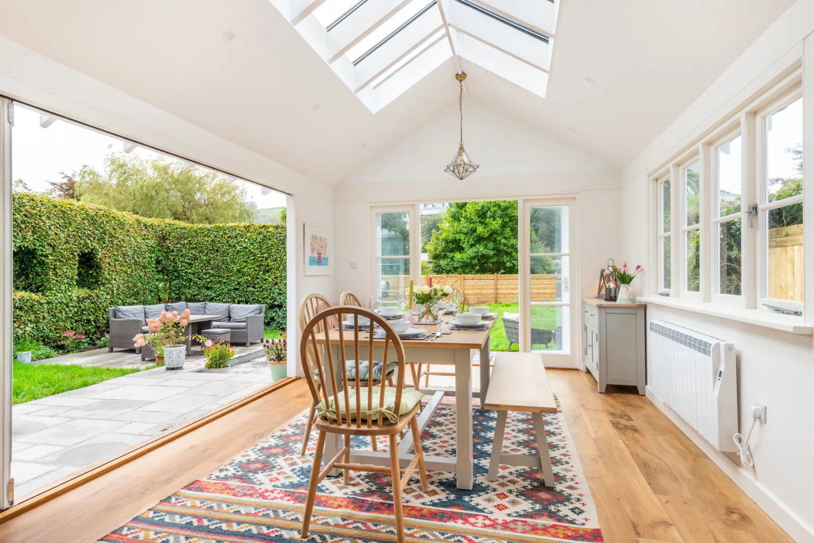 The lovely conservatory leading out to the pretty garden.