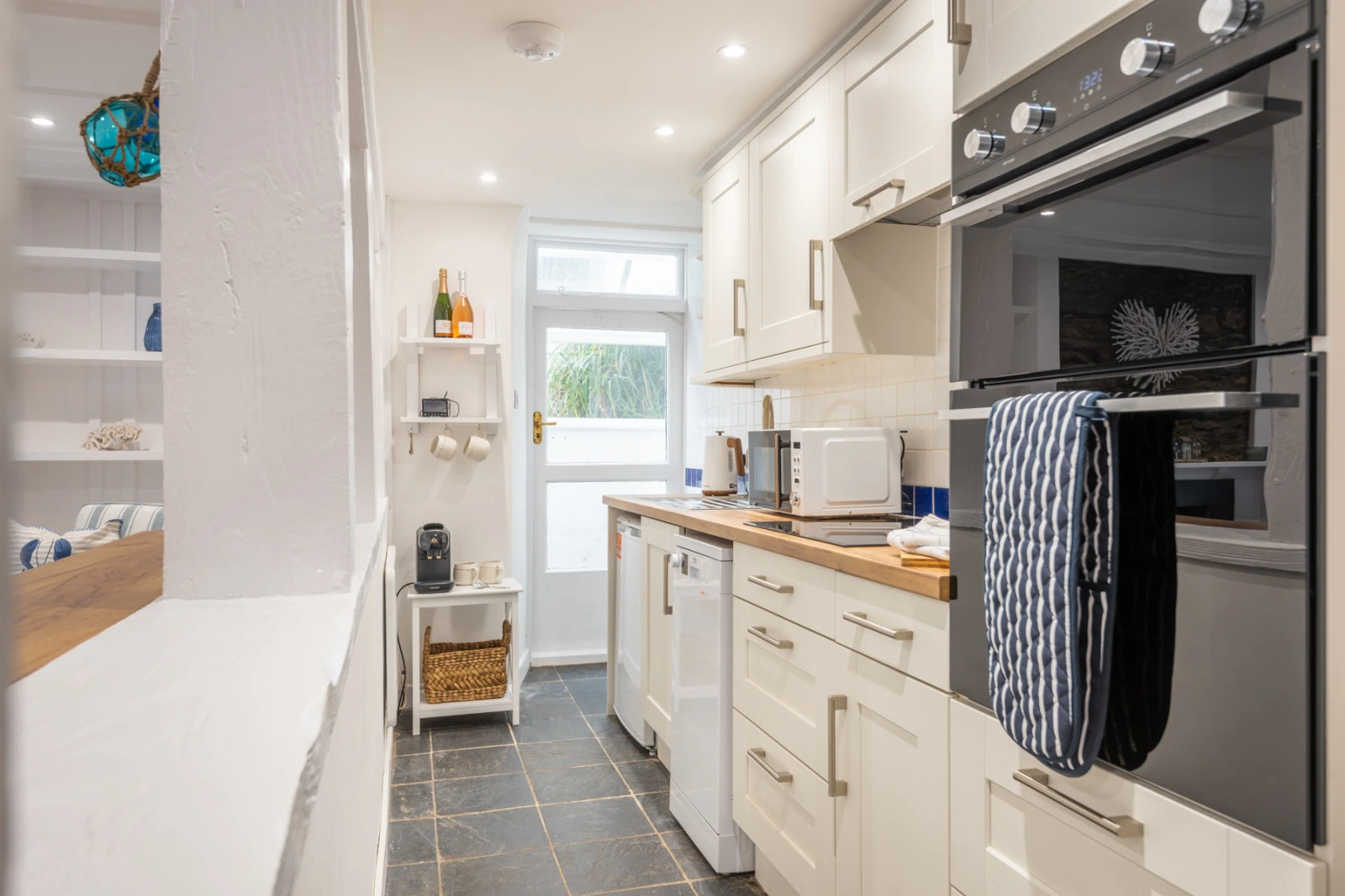 Modern kitchen with additional fridge / freezer in lean to