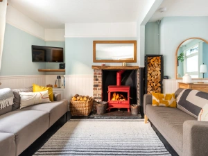 Relax with the log burner roaring away after a busy day exploring South Devon