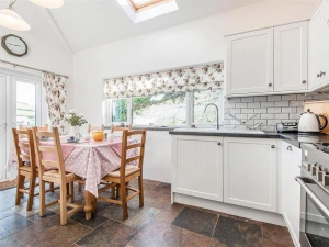 The modern kitchen and dining area