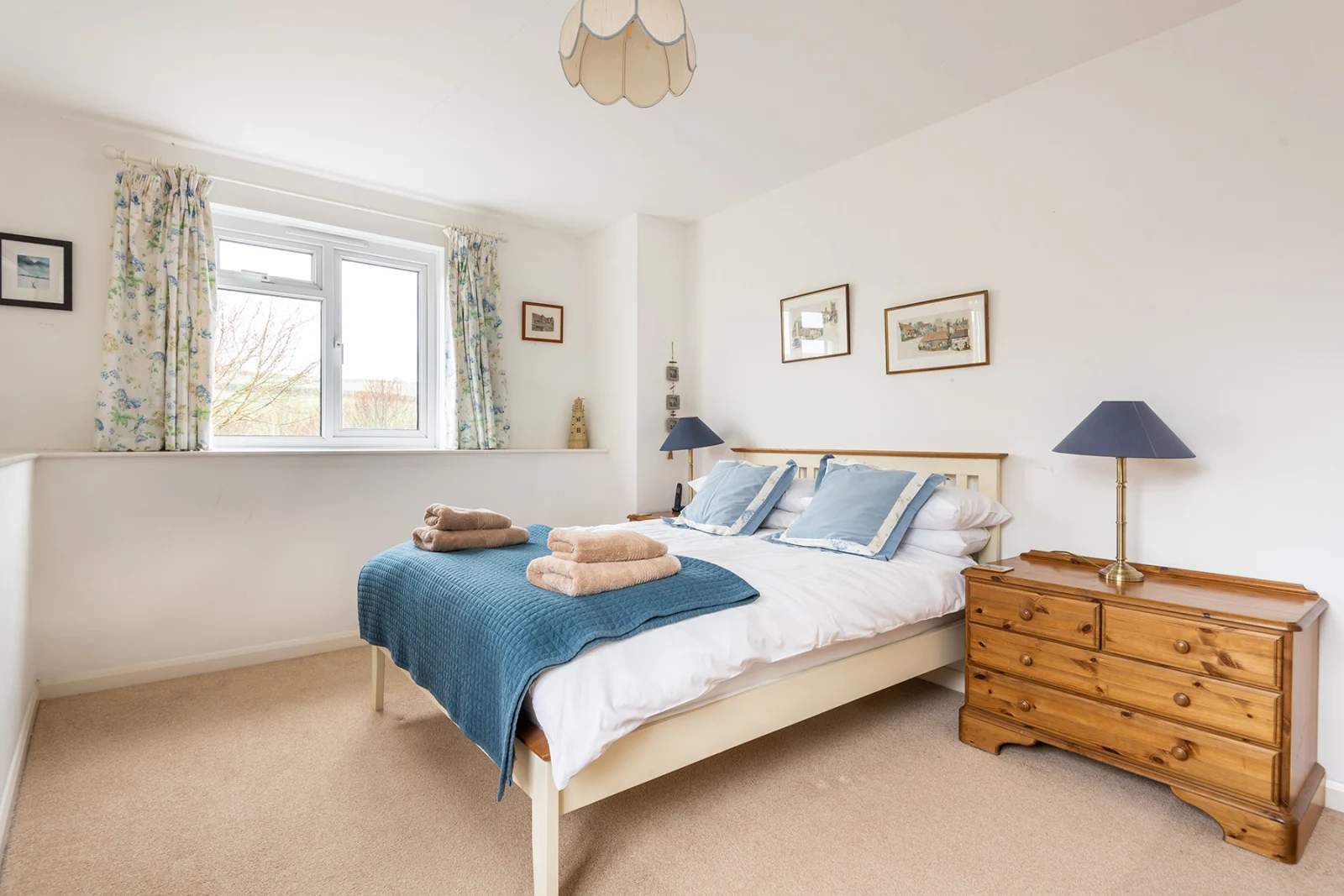 The light and airy main bedroom in the far wing