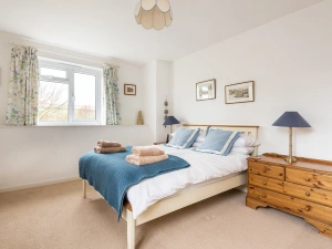 The light and airy main bedroom in the far wing