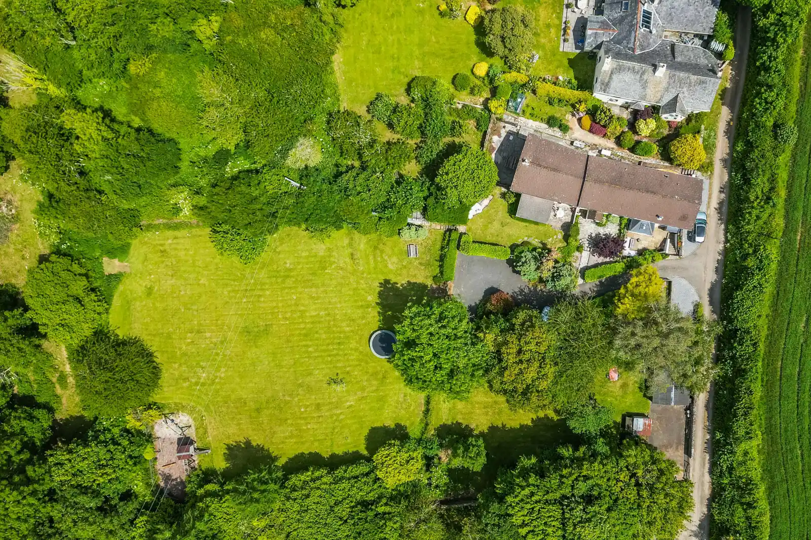 Surrounded by scenic countryside with its own 1 acre paddock and a play area