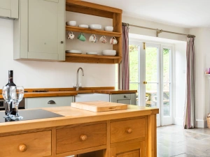 Open plan kitchen with patio doors
