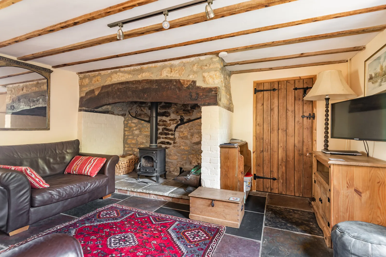 Lounge area with Smart TV and wood burner