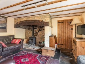 Lounge area with Smart TV and wood burner