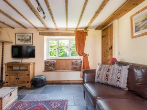 Lounge area with Smart TV and wood burner