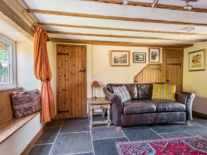 Lounge area with Smart TV and wood burner