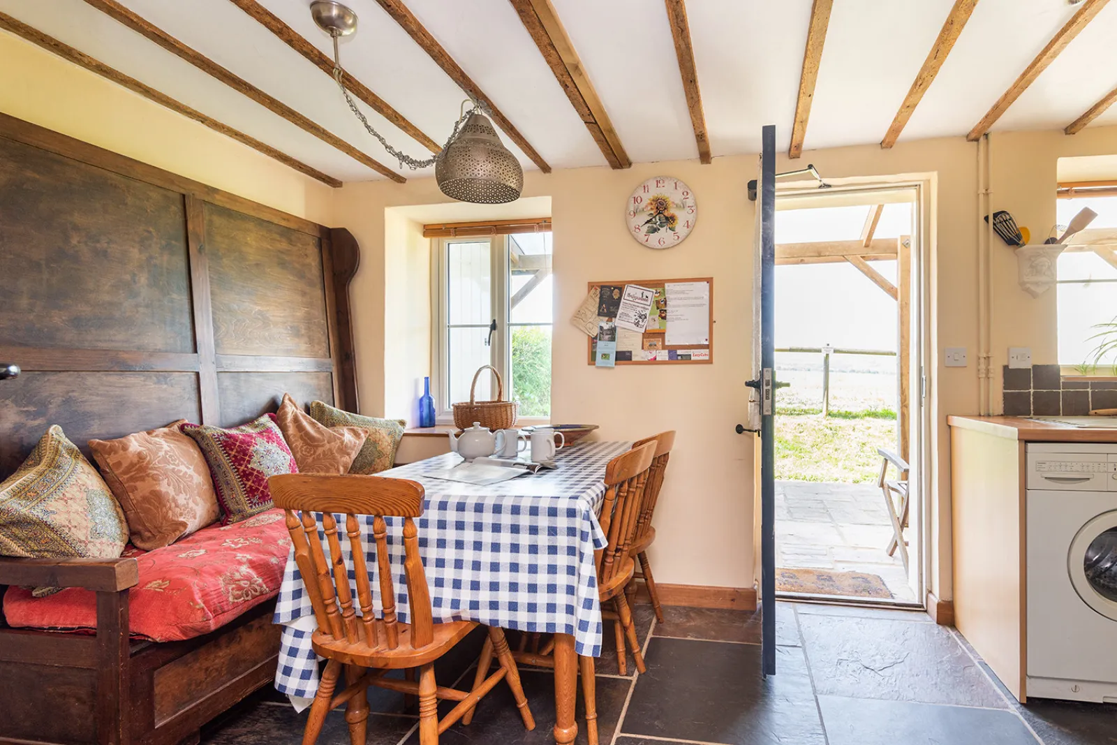 Dining table within kitchen/dining room with access to the rear garden 