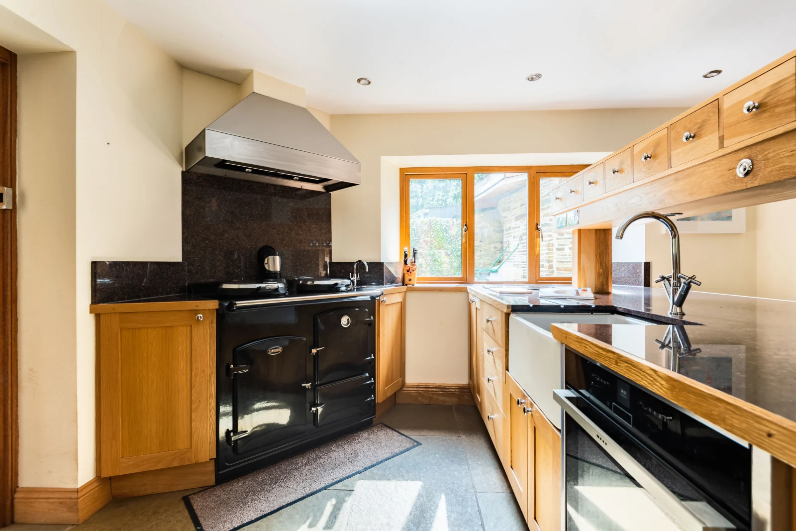Kitchen with oven and Sandyford range cooker
